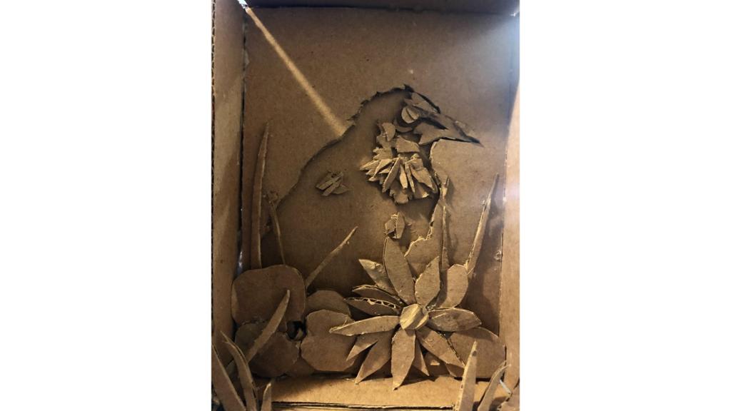Cardboard cut out of bird and flowers