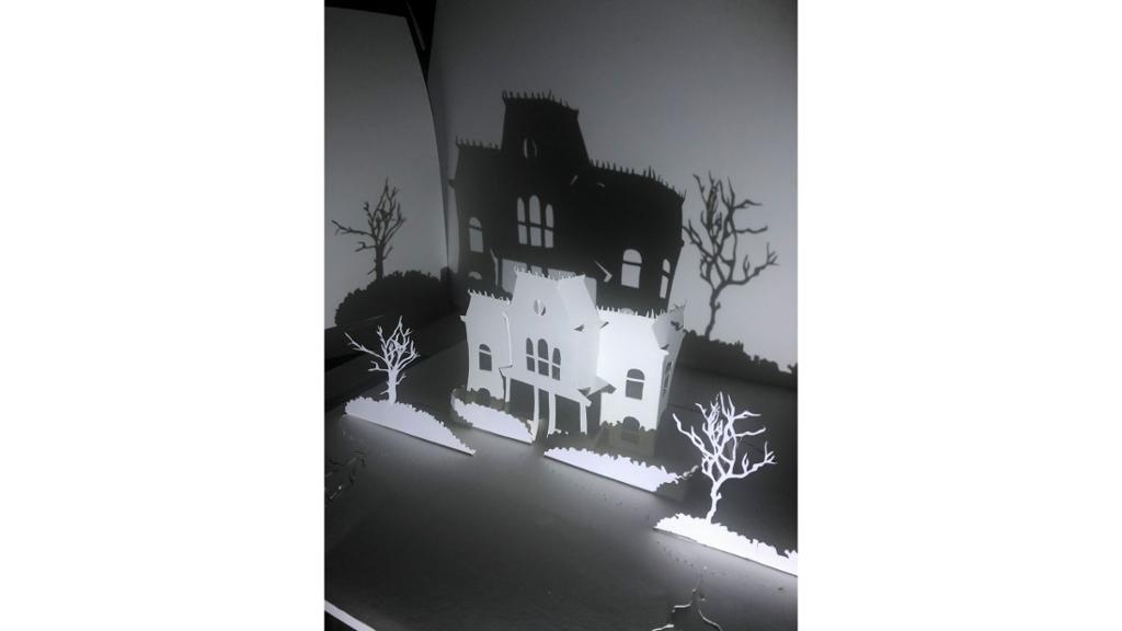Paper cut out of haunted house