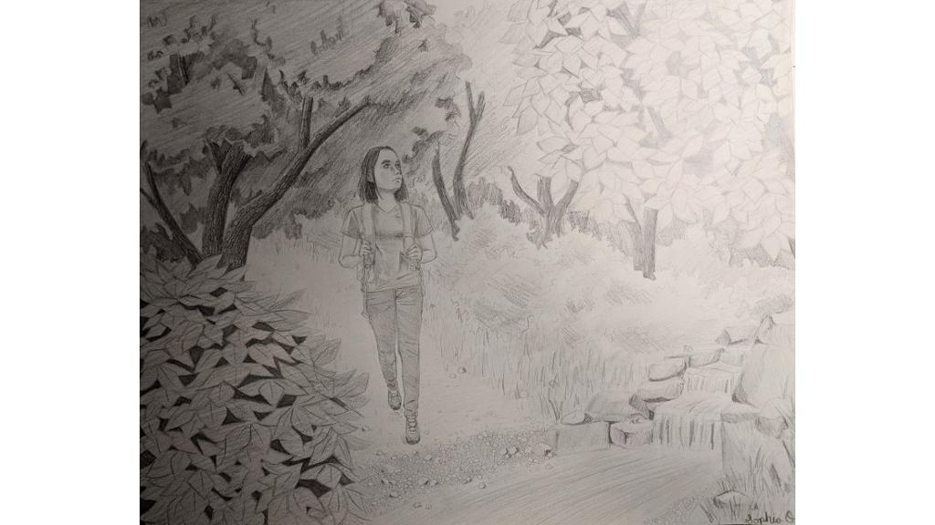 Woman walking through forest path