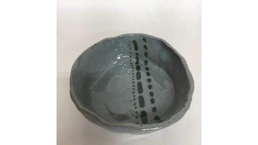 Gray bowl with black stripe through center