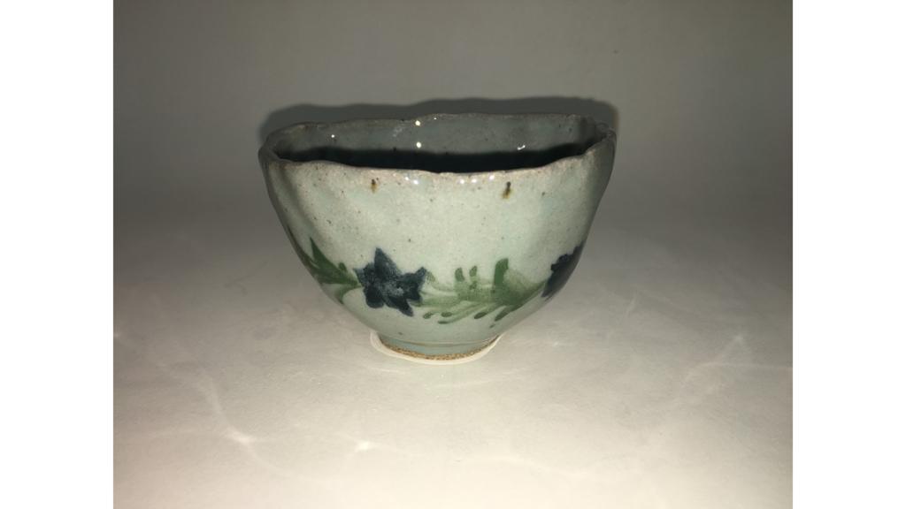 Bowl with flowers painted along side
