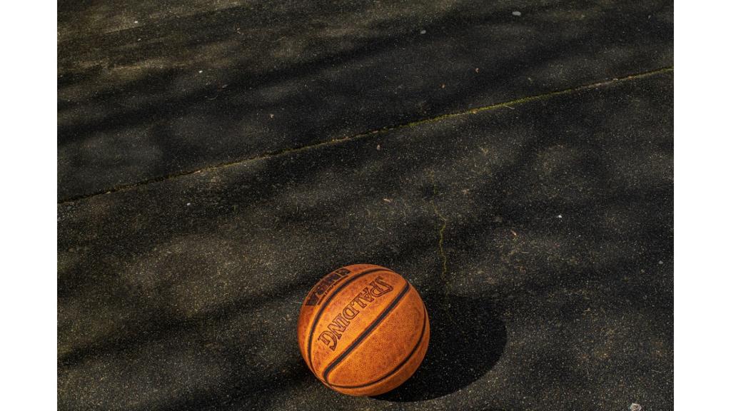 Basketball sitting on pavement