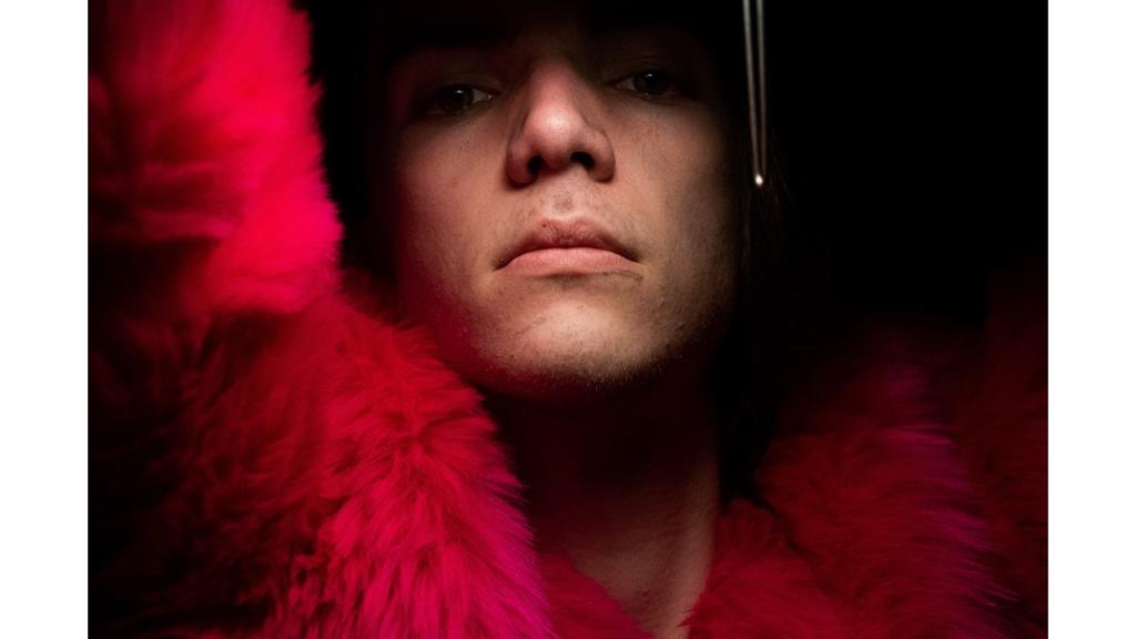 Close up photo of a person in a pink jacket