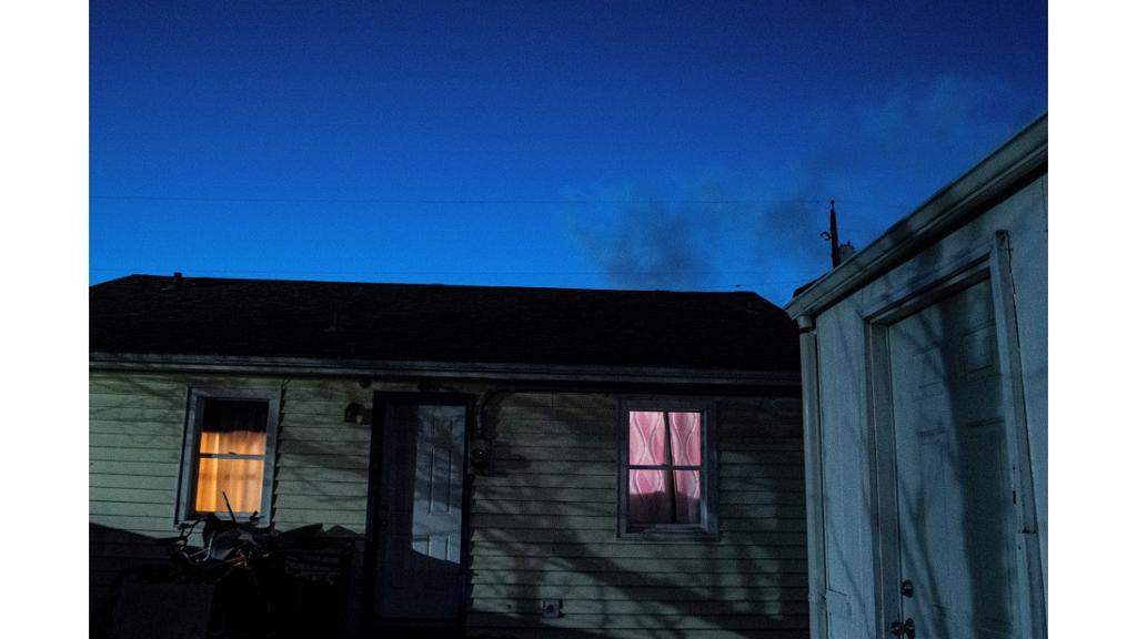 House at night with lit up windows