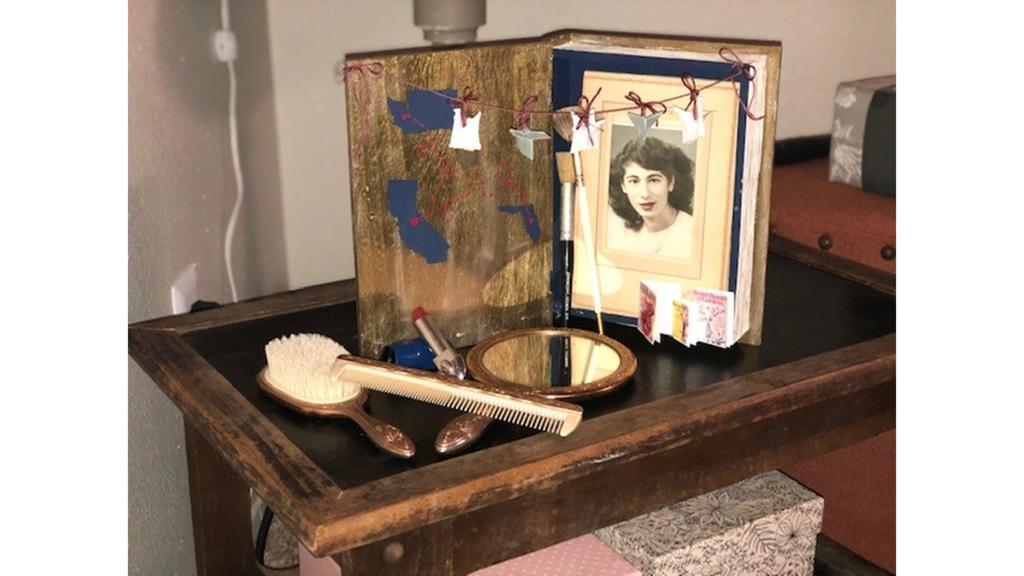 Bedside table with brush, mirror, portrait