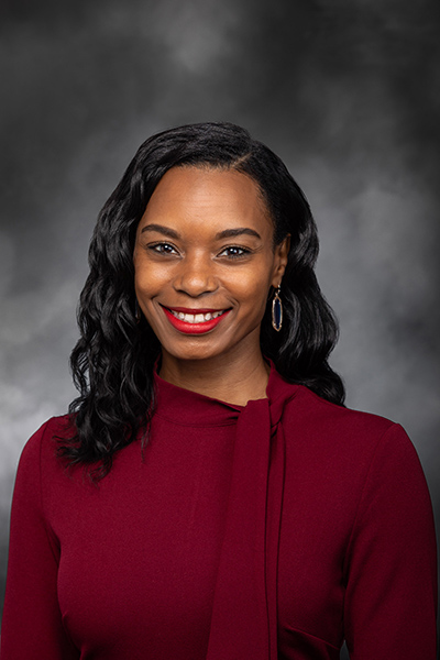 woman in a red sweater smiling