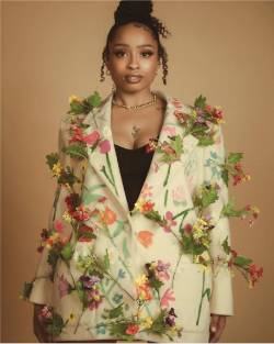 Headshot of Jonarra Swanson in a flowered blazer