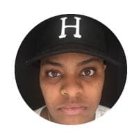 female with slight smile looking at camera