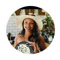 female in dress with sun hat on