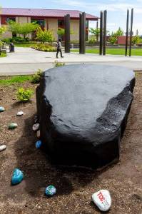 Large black rock facing campus commons