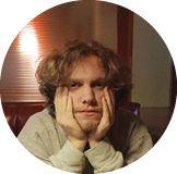 male with hands on cheeks