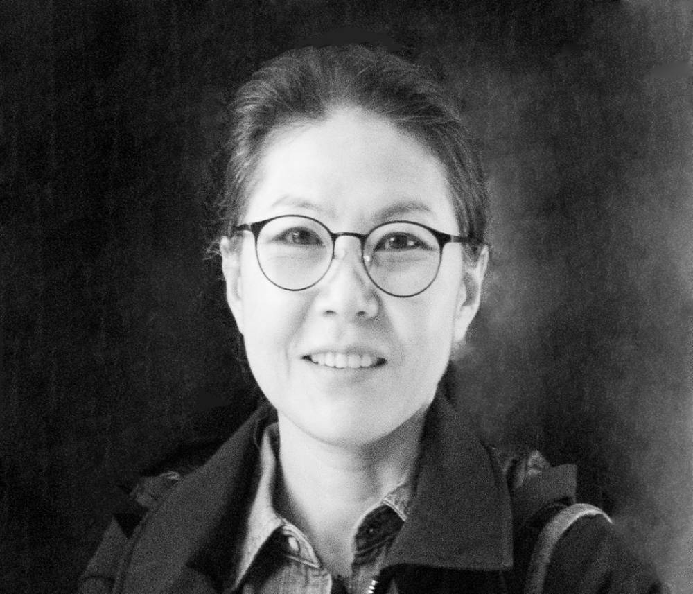 Black and White headshot of Emily J. Won