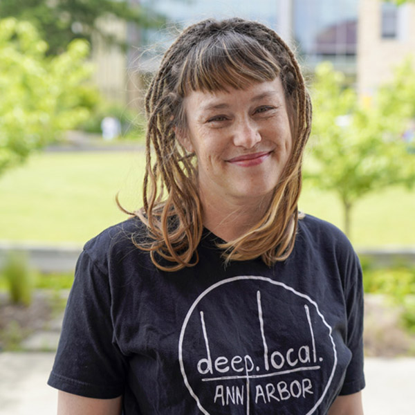woman in black Ann Arbor T-shirt smiling 