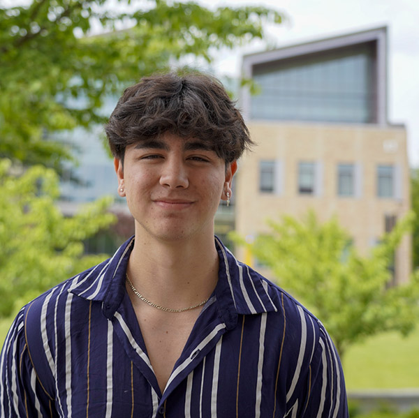 man in a striped shirt smiling 