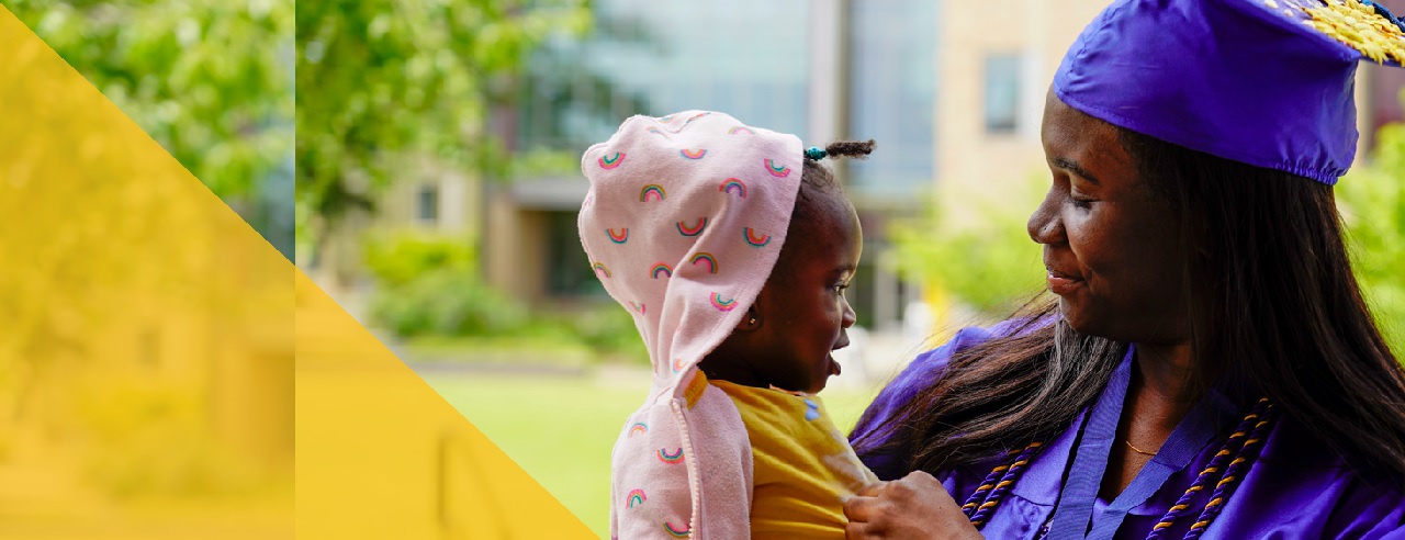 Student graduating and a child