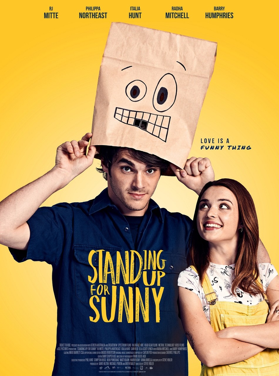 poster for Standing Up for Sunny, with a man looking out from under a paper bag and a woman standing next to him. 