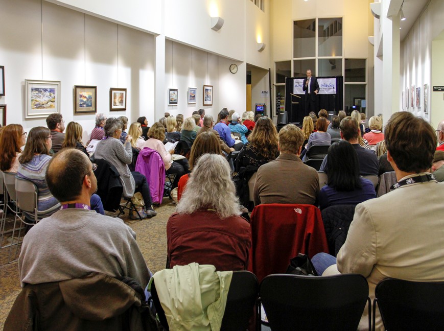 people seated watching speaker