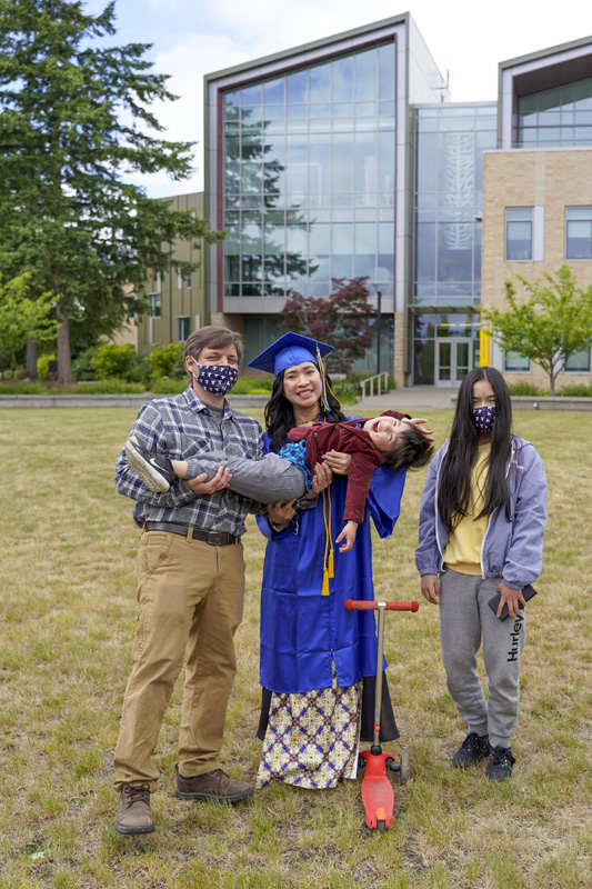 Thi Huynh and family in the TCC campus commons
