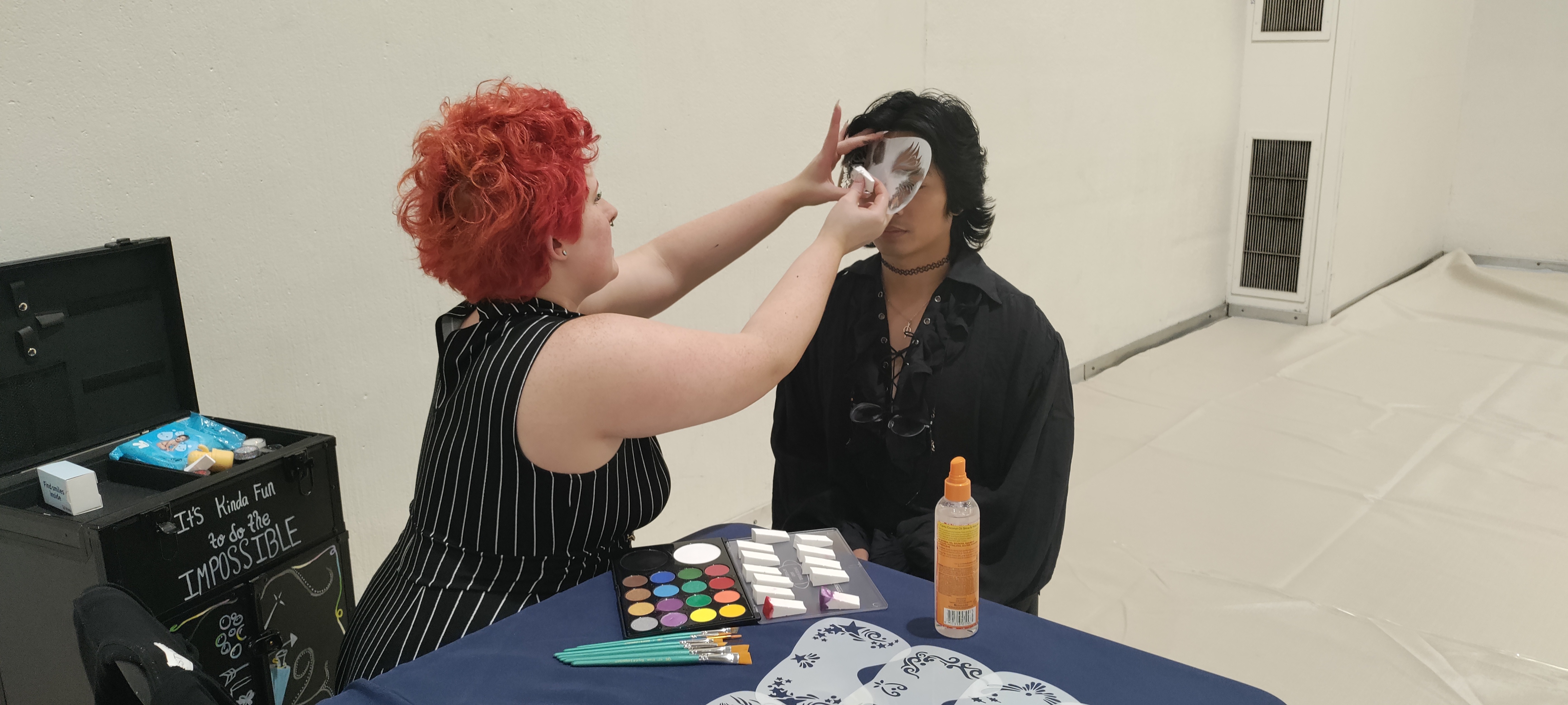 Photo of a person doing face painting.