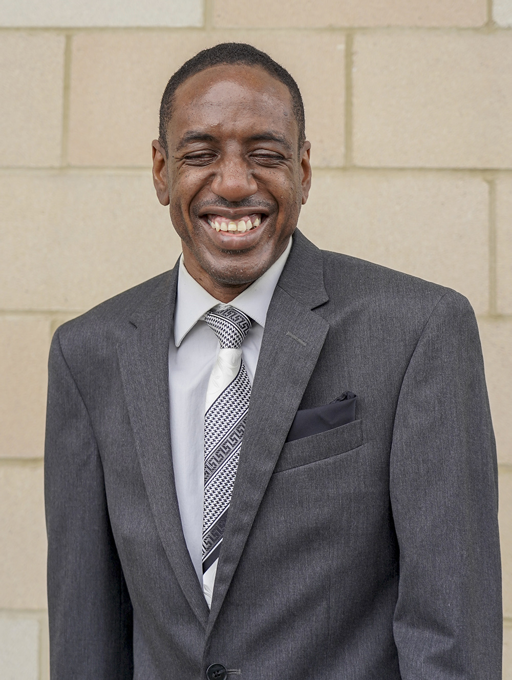 man in suit smiling 