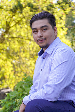 Man in blue shirt smiling 