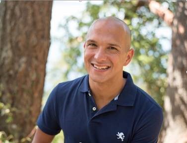 Brandon Censon smiling in a polo shirt