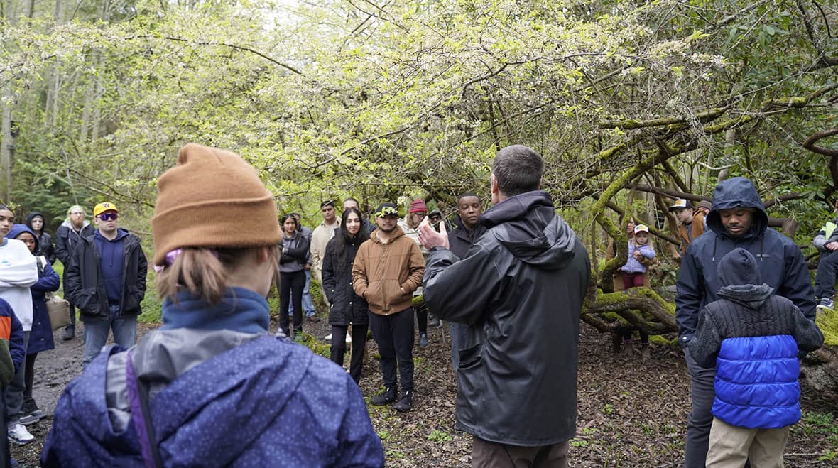 People gather by the creek