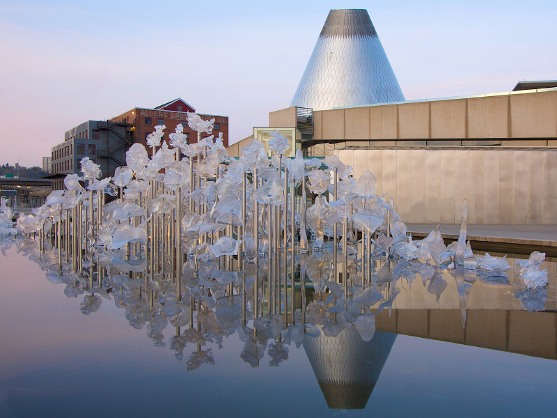 The Museum of Glass cone reflected in the sculpture pond 